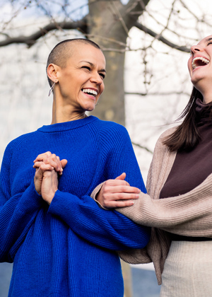 two women laughing together outdoors in casual clothing enjoying life and friendship related keywords 5 joy 5 connection 5 happiness 5 laughter